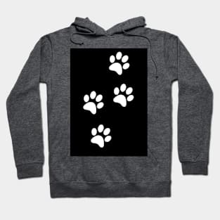 White Paw-prints on a black surface Hoodie